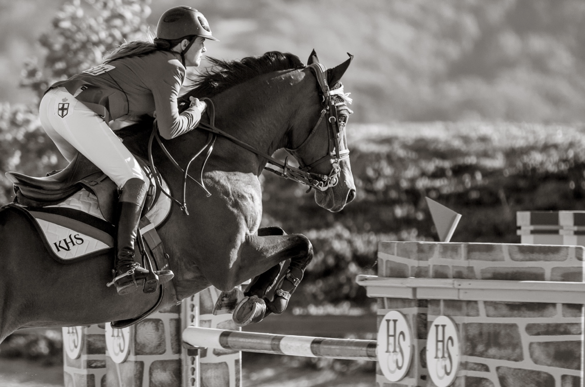 “Kristin Hardin is just simply bad ass,” Tara says. “She flies over these jumps. I like to think of this photo as a great branding photo, the jump, the saddle pad, the britches.”