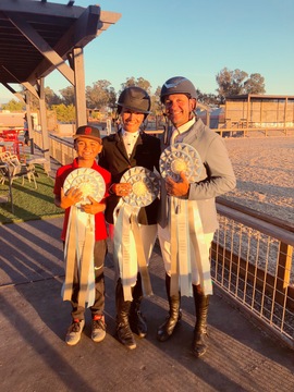 Nina and Mariano with their son, Nico, after a successful finish on three horses in the ribbons in the $40,000 Lugano Diamonds Grand Prix. Photo: Estancia Farms client