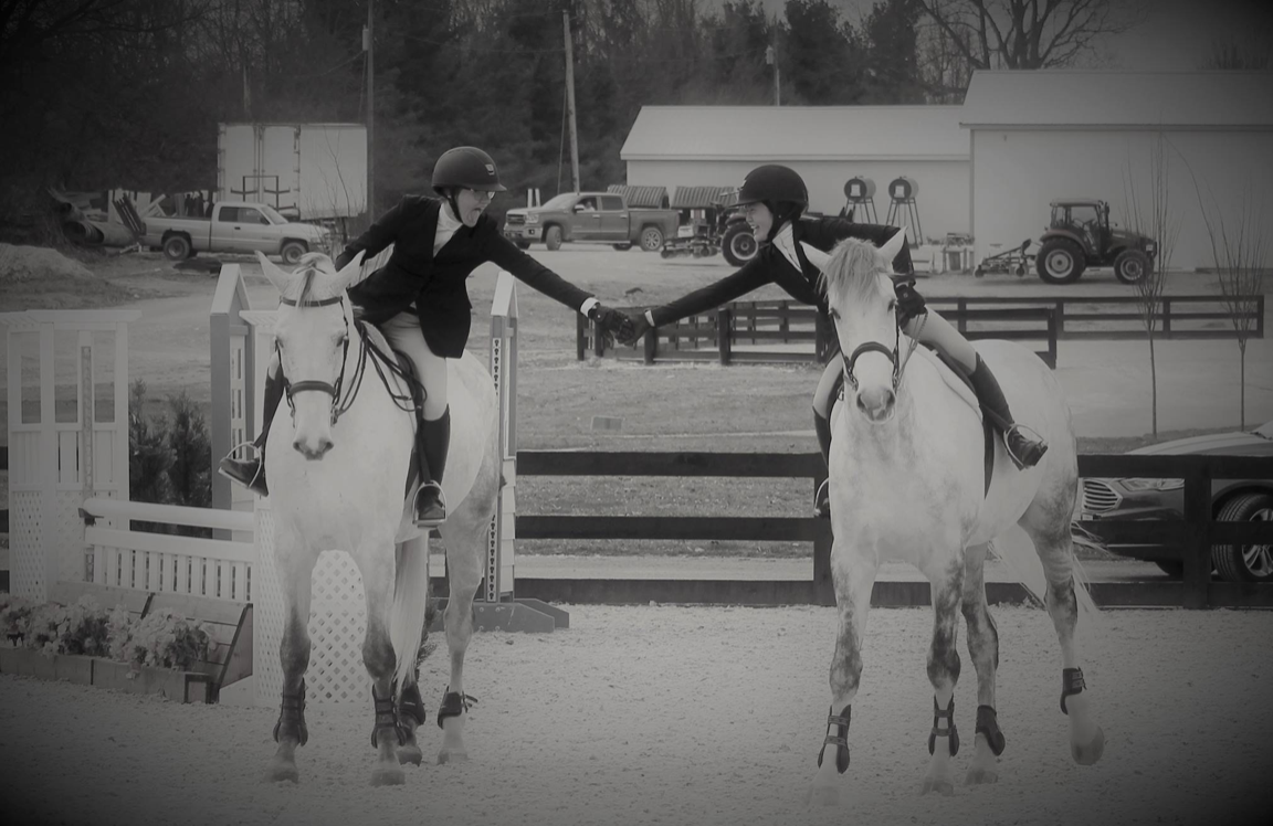 Olive Hill Sporthorses riders congratulate each other on a good round. Photo courtesy of Diana Conlon.