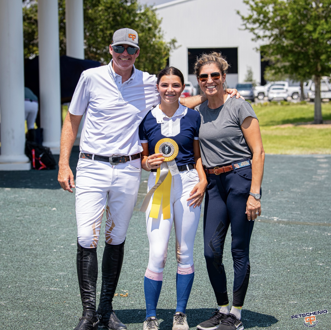 Peter and Nathalie with a student.