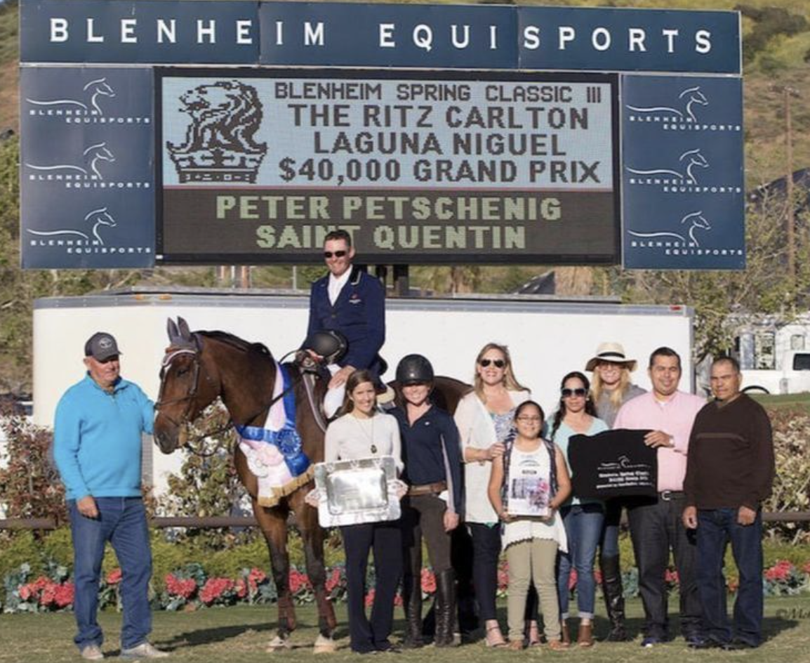 Peter and Saint Quentin with Sergio Farias, the Mayor Pro Tem of San Juan Capistrano, and his family; Carrie Borg of The Ritz Carlton; and Lauren Davis of EquiFit after winning the Ritz Carlton Laguna Niguel $40,000 Grand Prix at Blenheim in 2017. Photo courtesy of Petschenig Show Jumping LLC.