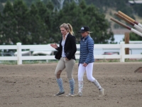 Linnea T and student at show, walking a course